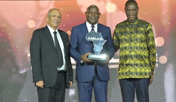 Equity Group Holdings CEO & MD Dr. James Mwangi (center) displays his Lifetime Achievement Award at the All-Africa Business Leaders Award in Sun City, South Africa.